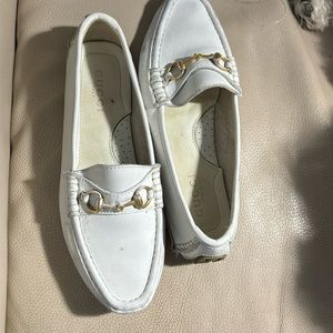 Woman’s white Gucci Driving shoe.
